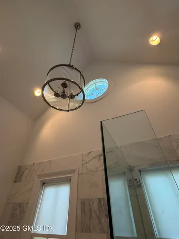 a picture of a room with a mirror and a fan