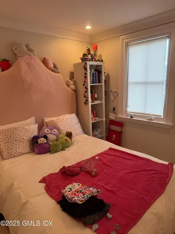 a bedroom with a bed and a closet