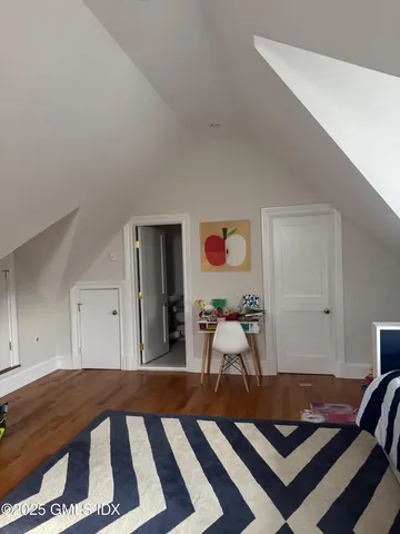 a living room with a rug and a table