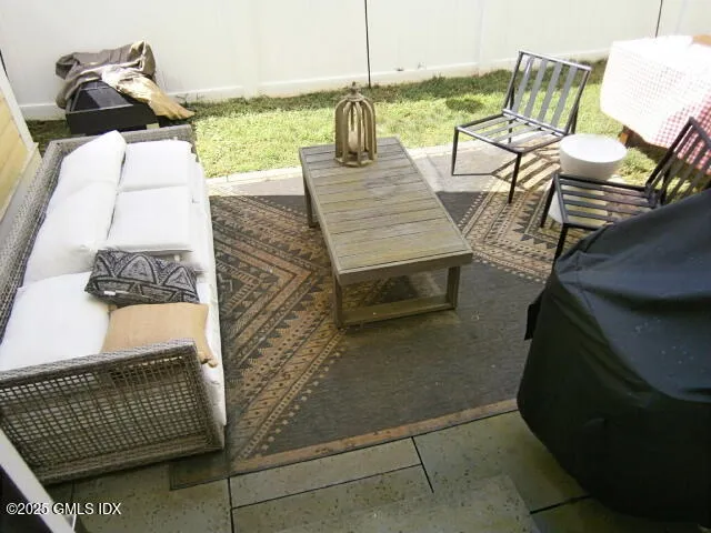 a view of balcony with furniture