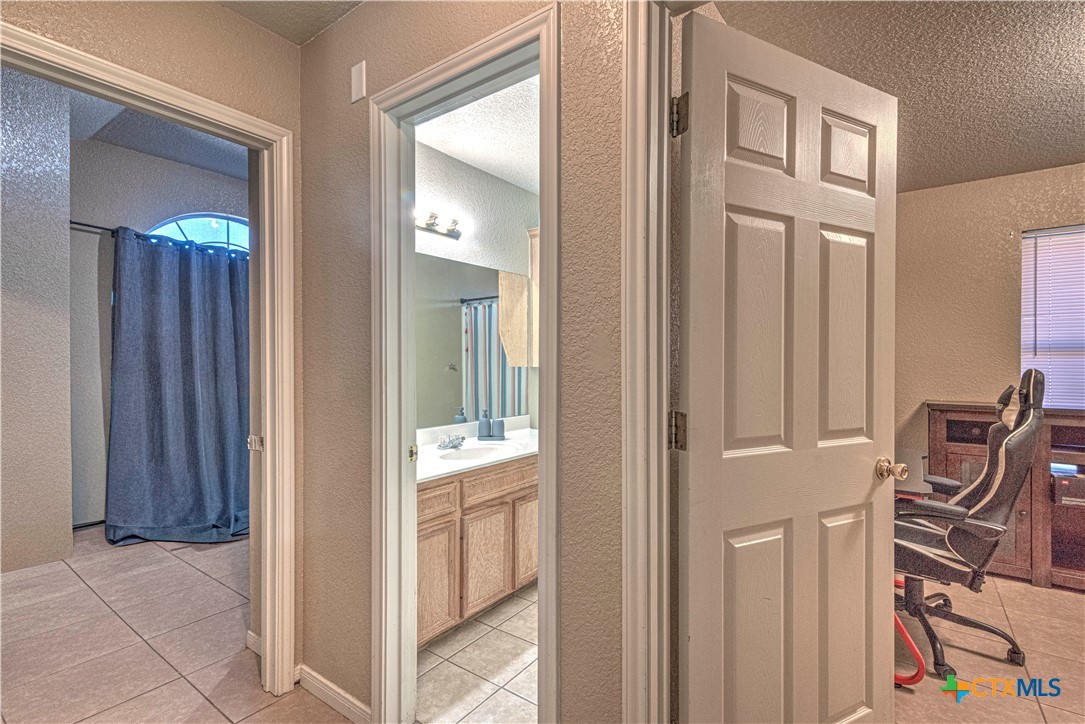 5004 Sunrise Street Killeen, TX 76542 - Photo 21 of 29 a view of a livingroom with wooden floor and furniture