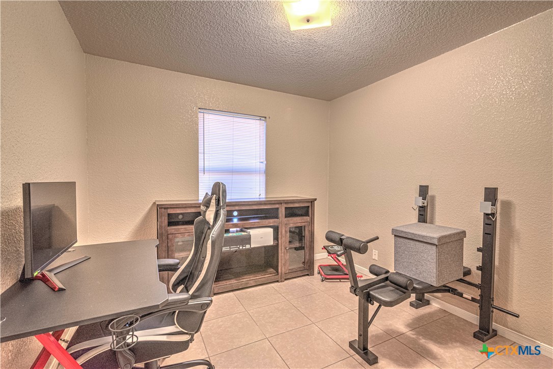 5004 Sunrise Street Killeen, TX 76542 - Photo 22 of 29 a view of a workspace with furniture and a window