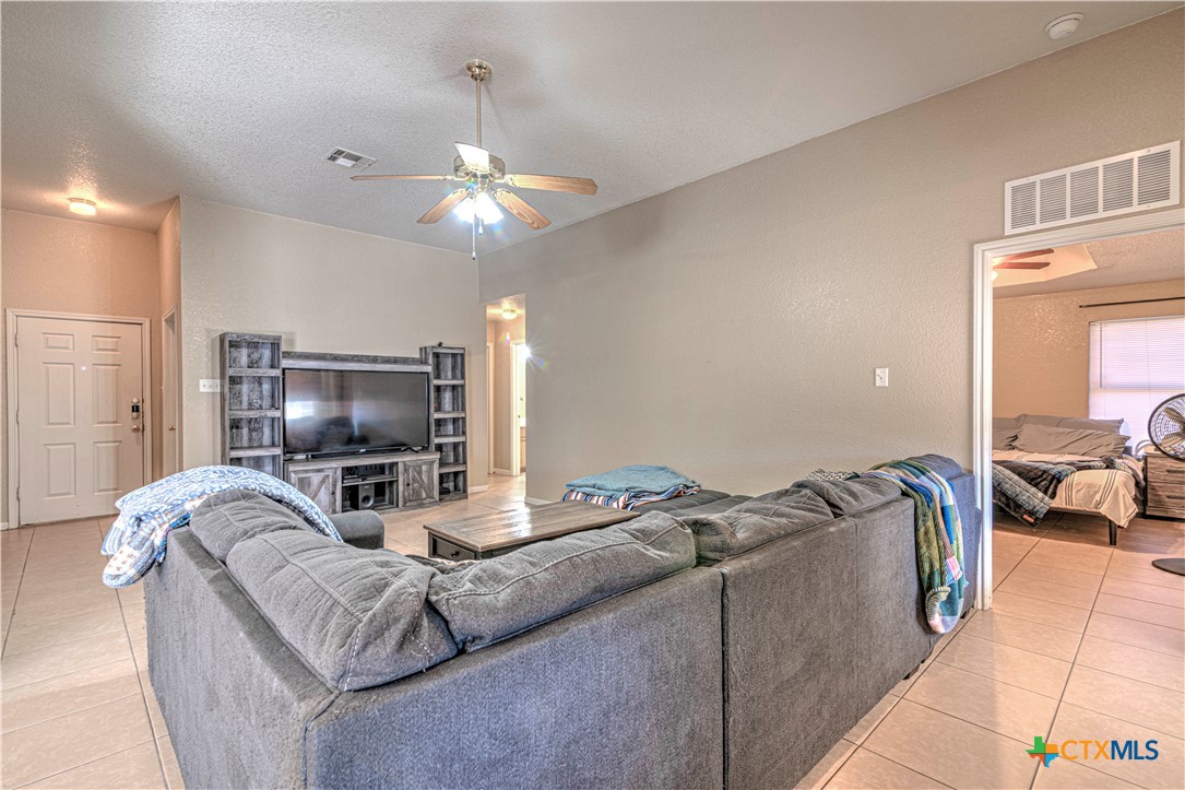 5004 Sunrise Street Killeen, TX 76542 - Photo 5 of 29 a living room with furniture and a flat screen tv