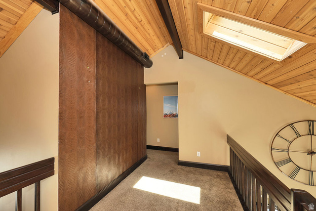 3104 East High Danish Road Sandy, UT 84093 - Photo 19 of 36 bonus space at top of the stiars. Vaulted wood-plank ceiling with exposed beams and a skylight