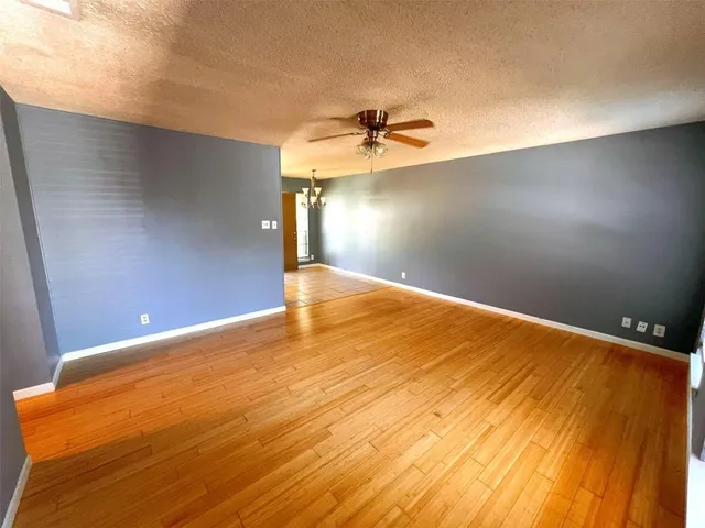 a view of a room with a wooden floor