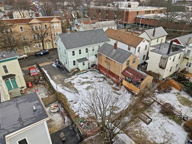 an aerial view of a house with outdoor space