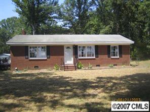 1936 New Salem Road Monroe, NC 28110 - Photo 1 of 7 a front view of a house with a yard