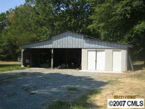 1936 New Salem Road Monroe, NC 28110 - Photo 2 of 7 a front view of a house with a yard