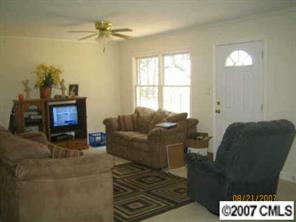1936 New Salem Road Monroe, NC 28110 - Photo 6 of 7 a living room with furniture and a fireplace