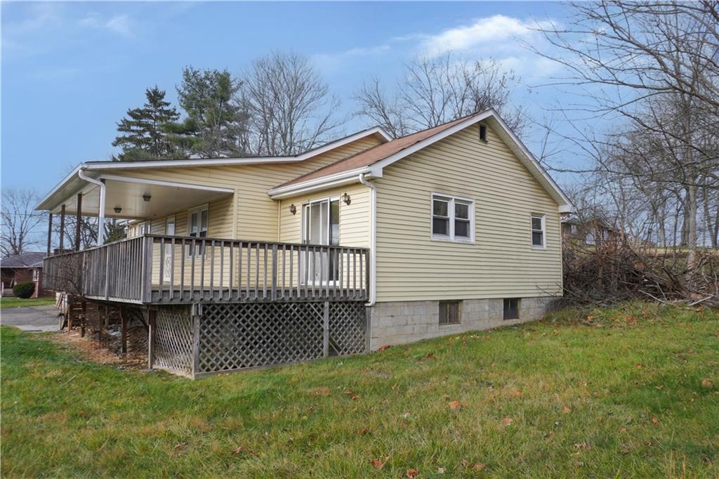 920 Collinsburg Road West Newton, PA 15089 - Photo 2 of 19 a view of a house with a yard and deck