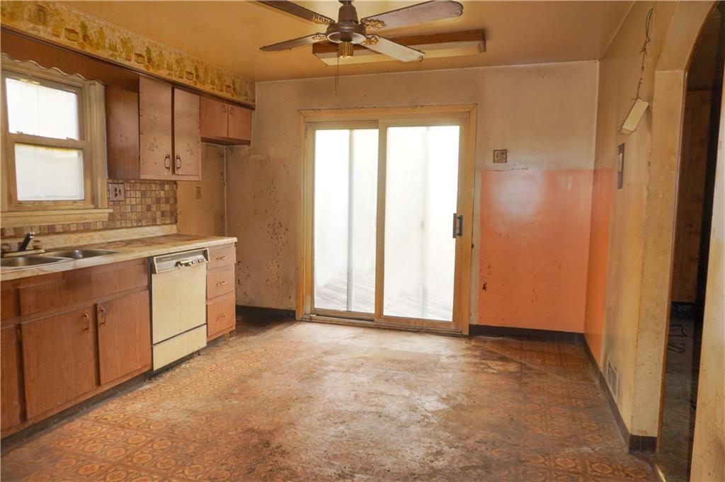920 Collinsburg Road West Newton, PA 15089 - Photo 7 of 19 a view of a kitchen with a sink and cabinet