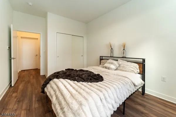 a bedroom with a bed and a mirror