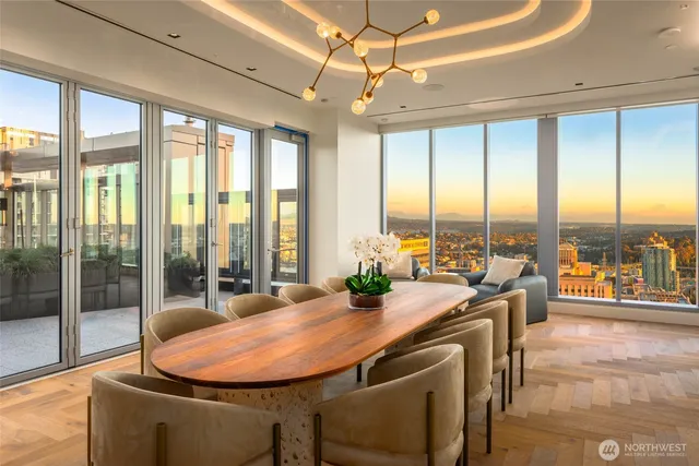 a dining room with a large window and table