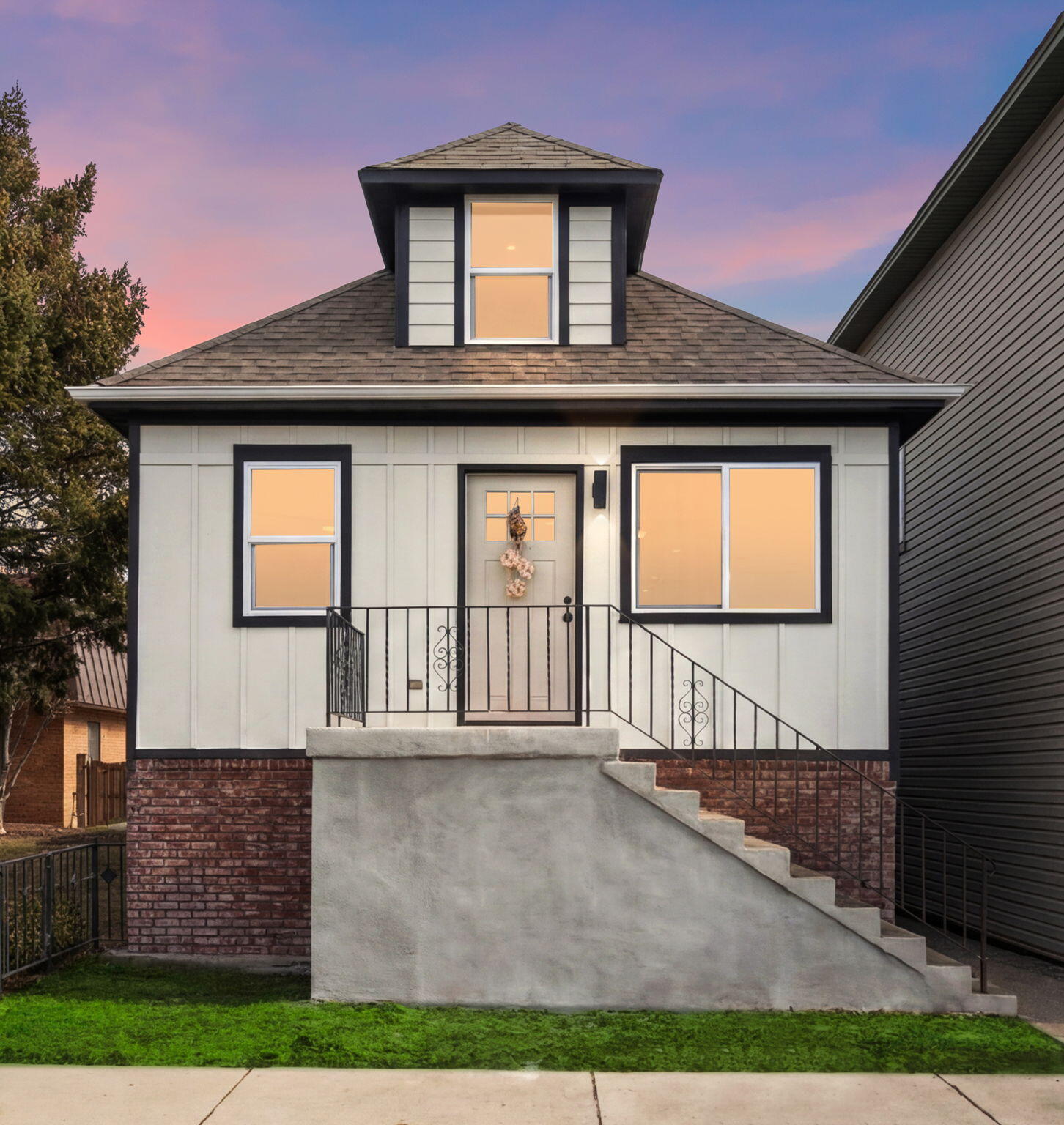a front view of a house with a yard