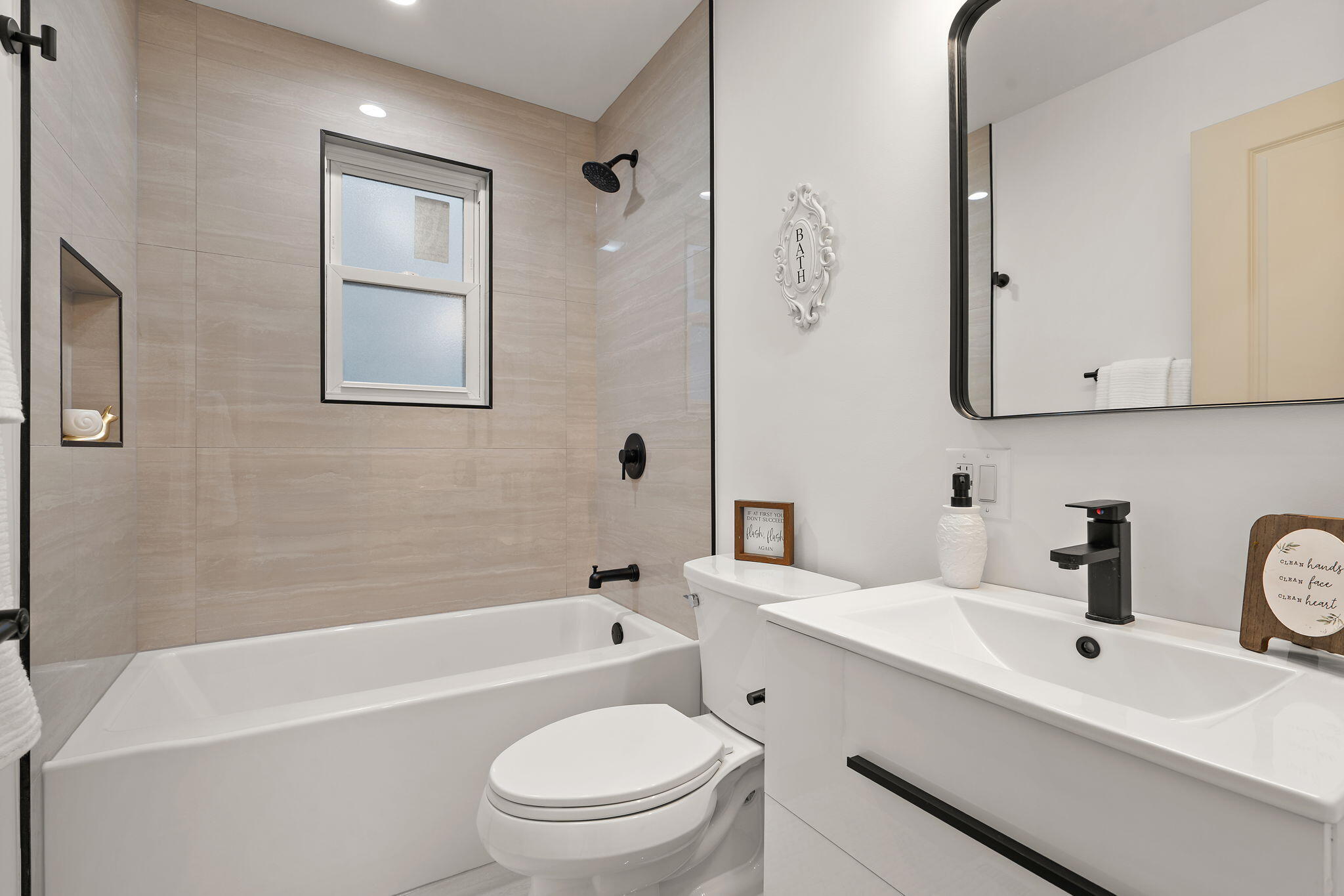 2017 Clark Street Whiting, IN 46394 - Photo 14 of 37 a bathroom with a toilet a sink a mirror a bathtub and vanity