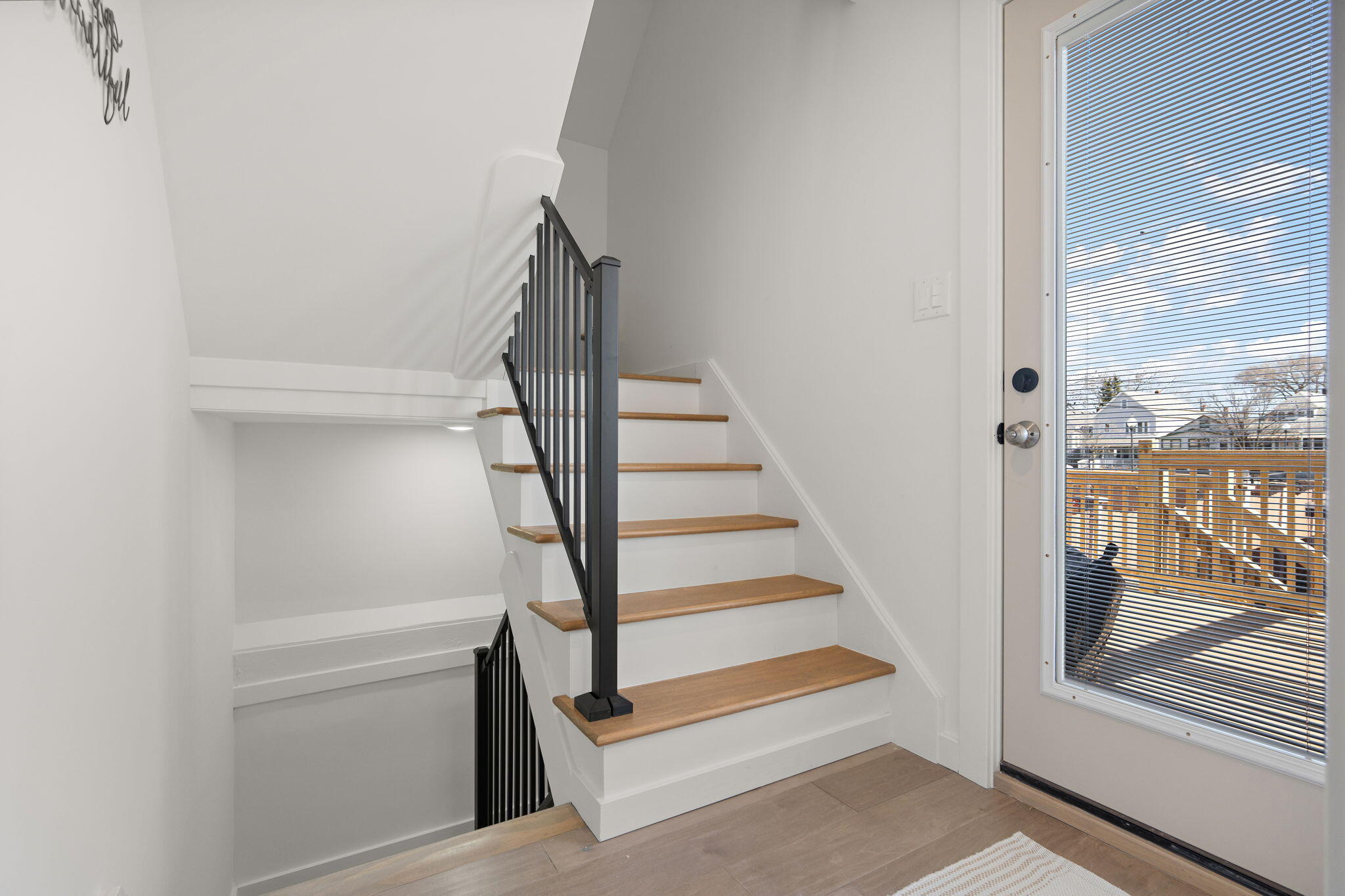 2017 Clark Street Whiting, IN 46394 - Photo 17 of 37 a view of staircase with wooden floor and white walls