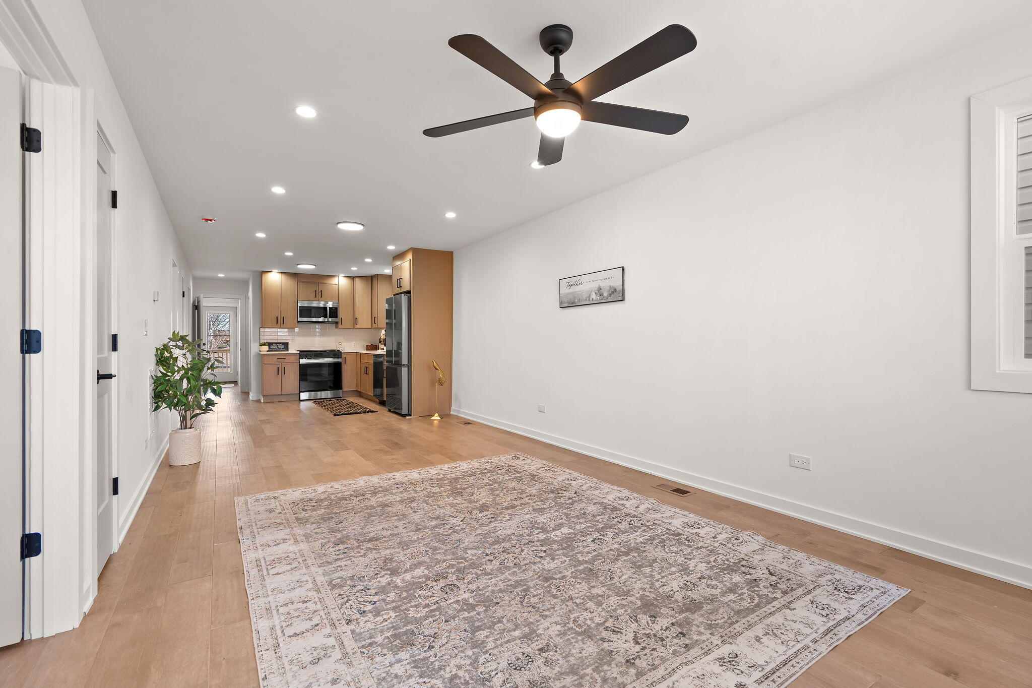 2017 Clark Street Whiting, IN 46394 - Photo 4 of 37 an empty room with wooden floor and a ceiling fan