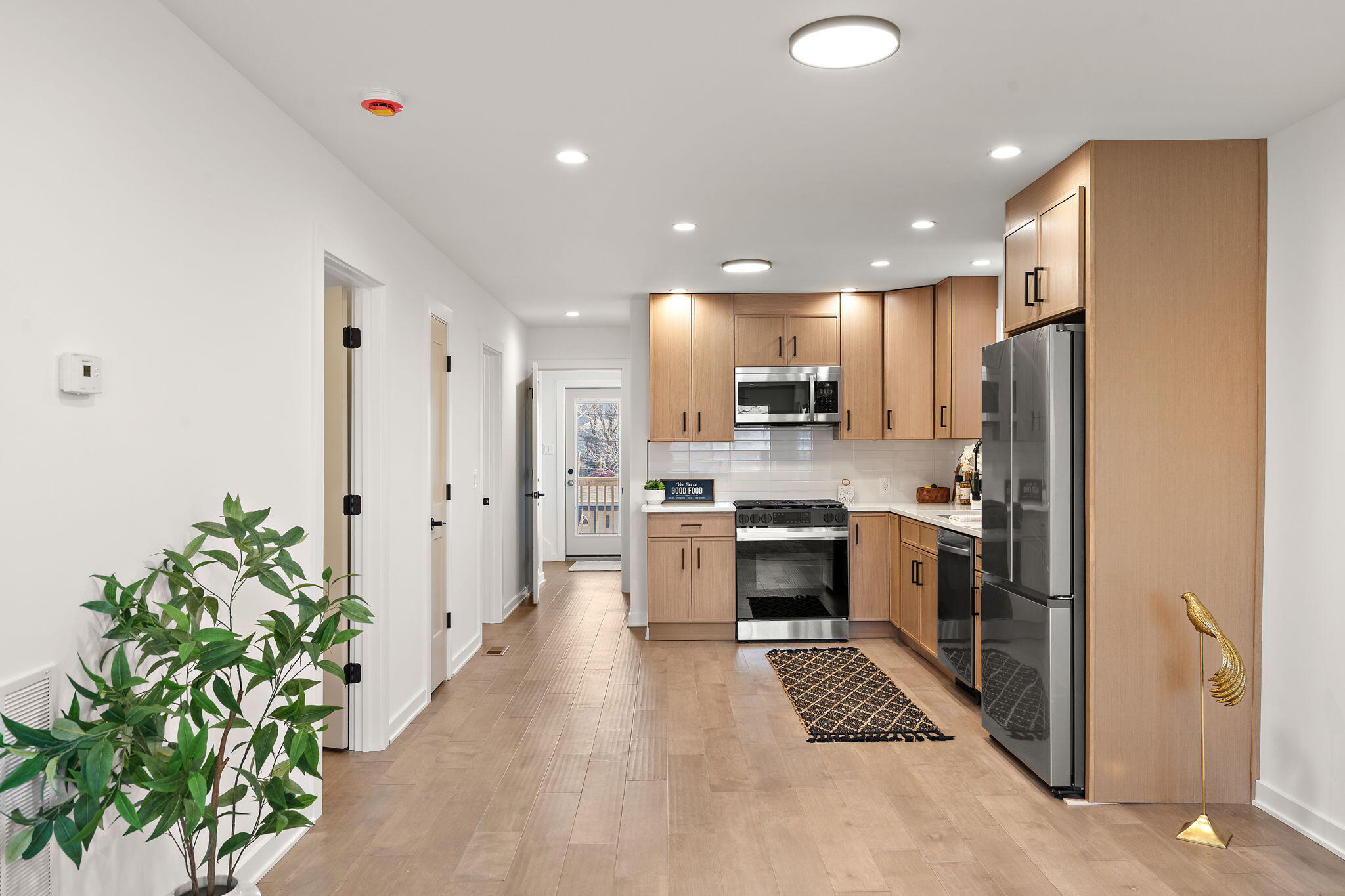 2017 Clark Street Whiting, IN 46394 - Photo 6 of 37 a kitchen with stainless steel appliances kitchen island granite countertop a refrigerator and a stove top oven