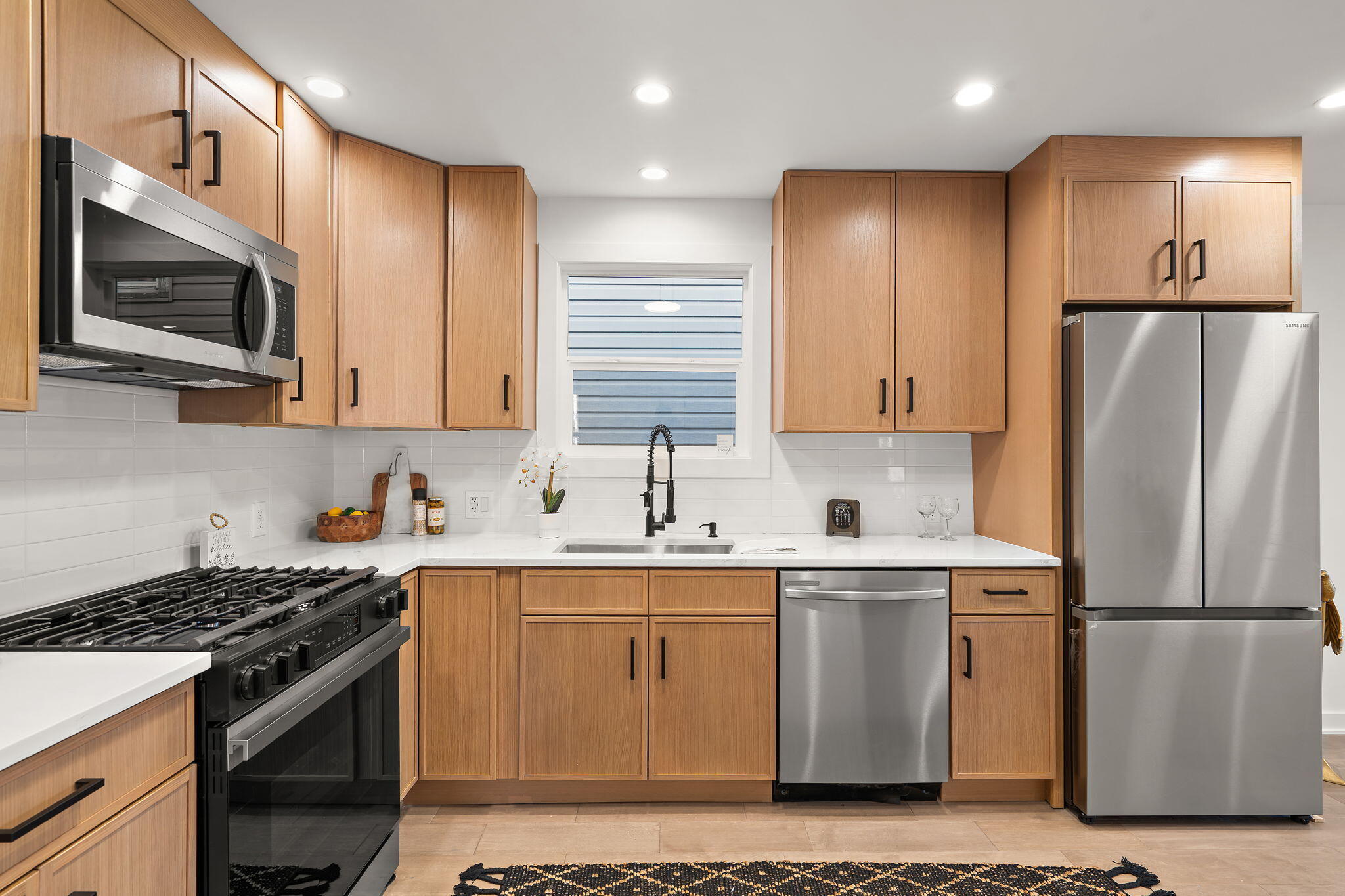 2017 Clark Street Whiting, IN 46394 - Photo 8 of 37 a kitchen with stainless steel appliances granite countertop a stove a refrigerator and a microwave