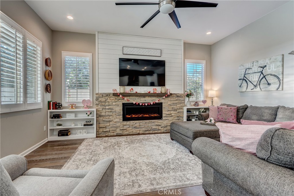 11137 Briar Rose Court Corona, CA 92883 - Photo 13 of 75 a living room with furniture and a fireplace