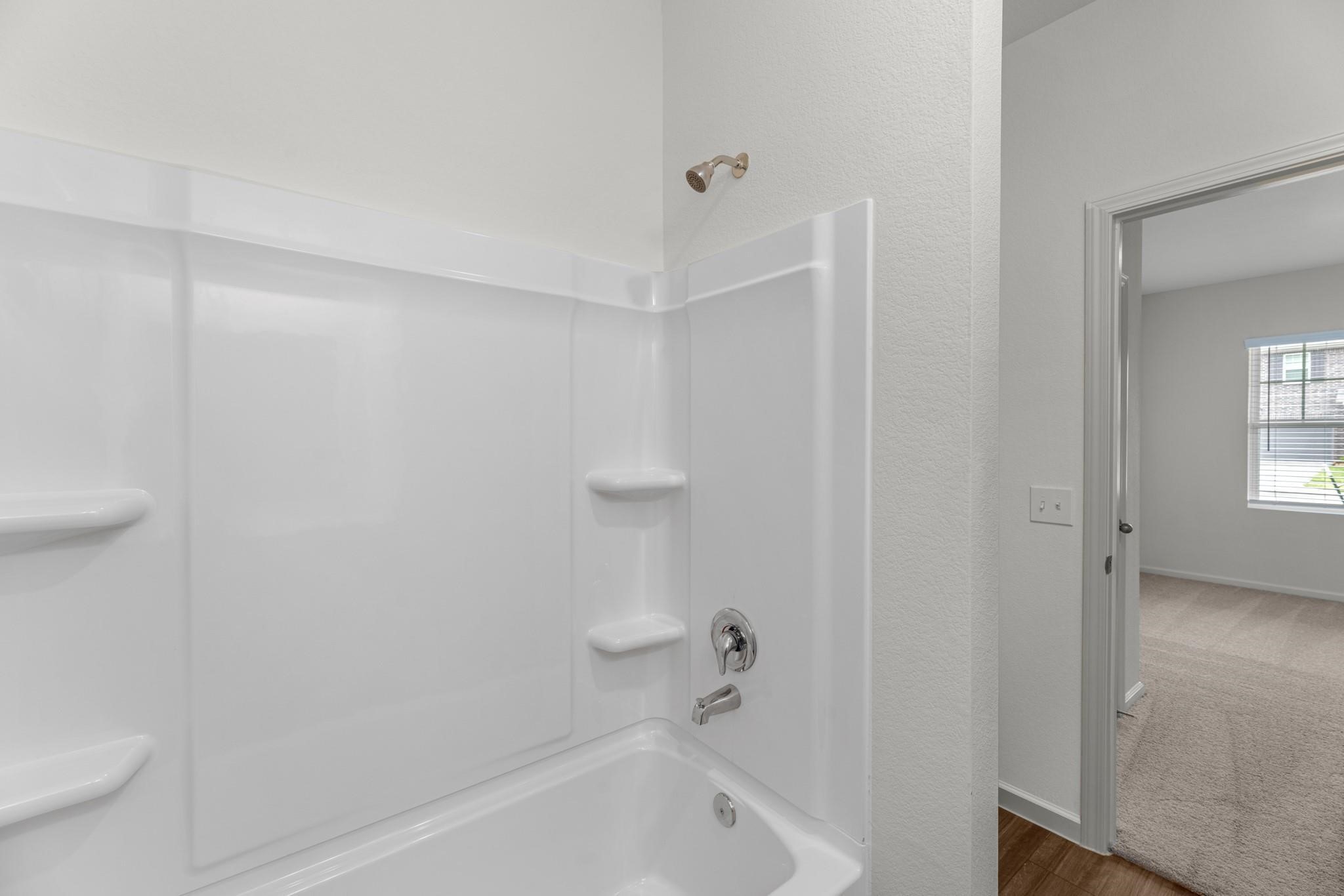 3203 Diamond Vw Lane Angleton, TX 77515 - Photo 14 of 17 a bathroom with a bathtub and a toilet