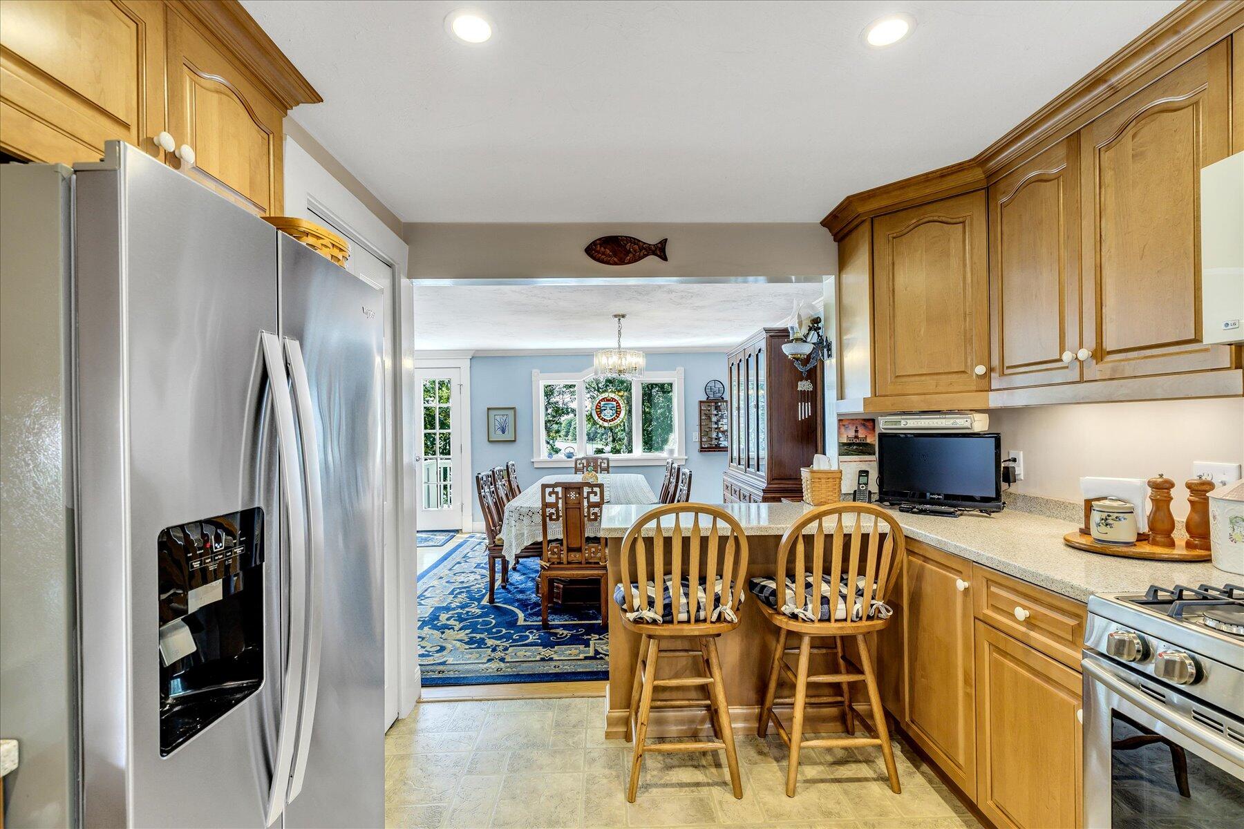 248 Wheeler Road Mashpee, MA 02649 - Photo 11 of 76 a view of a dining room with furniture window and outside view