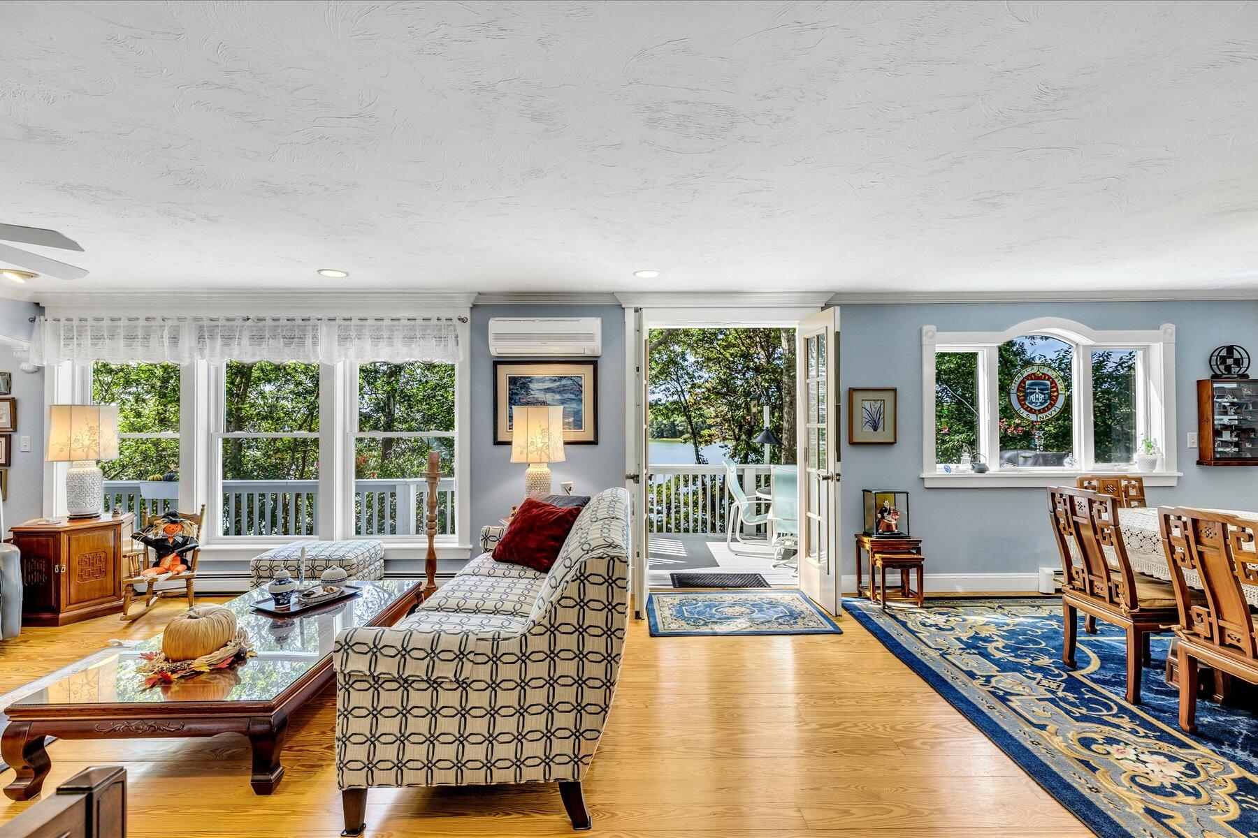 248 Wheeler Road Mashpee, MA 02649 - Photo 15 of 76 a living room with furniture and a large window