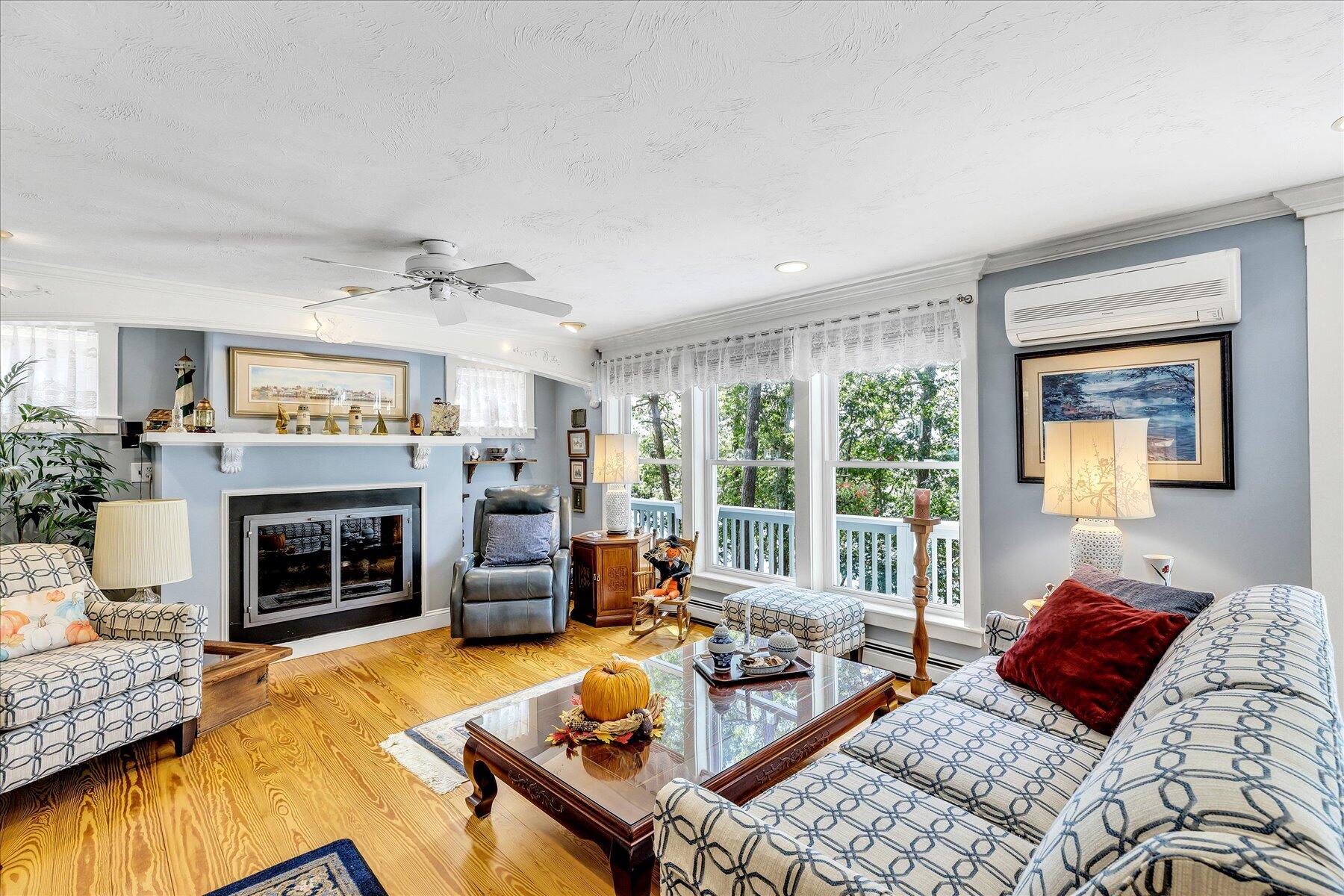 248 Wheeler Road Mashpee, MA 02649 - Photo 20 of 76 a living room with furniture and a fireplace