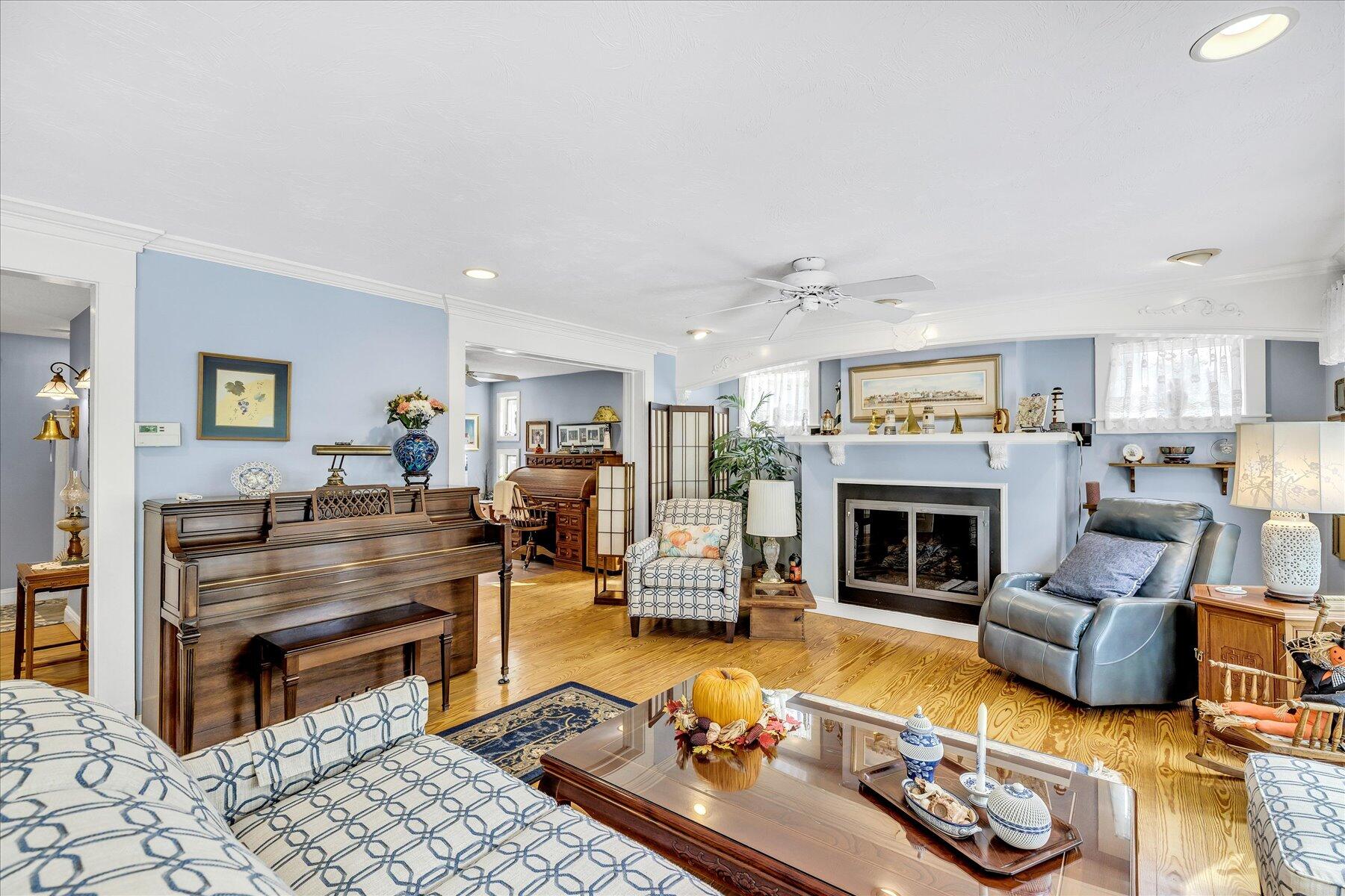 248 Wheeler Road Mashpee, MA 02649 - Photo 22 of 76 a living room with furniture and a fireplace