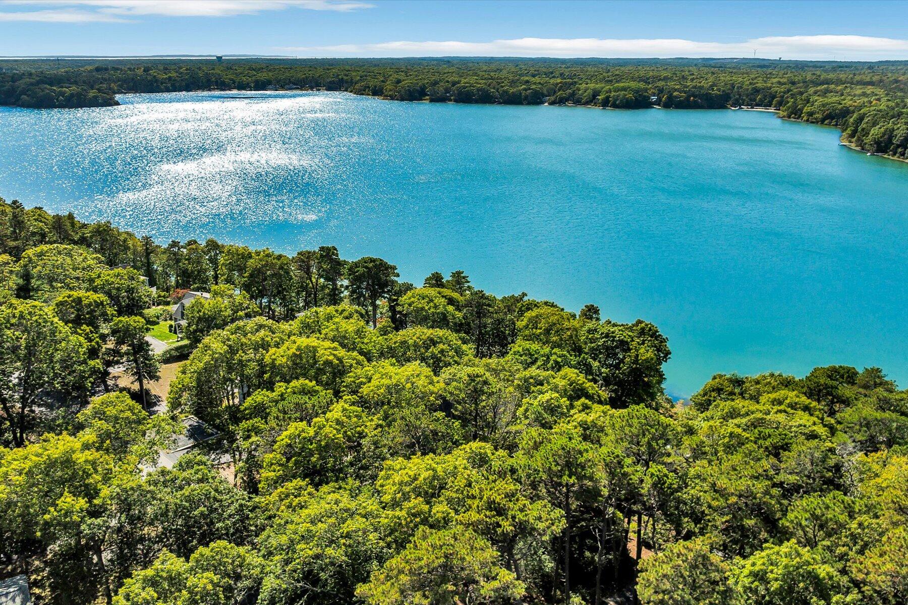 248 Wheeler Road Mashpee, MA 02649 - Photo 3 of 76 a view of a lake with a lake
