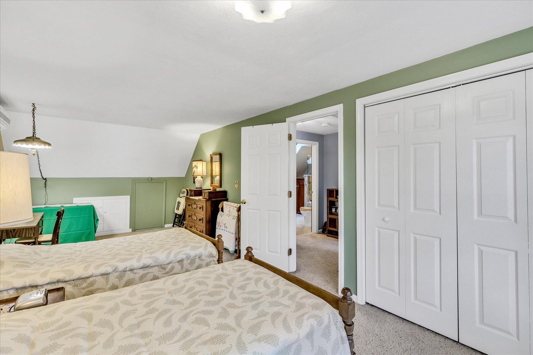 248 Wheeler Road Mashpee, MA 02649 - Photo 33 of 76 a bedroom with a bed and a large mirror