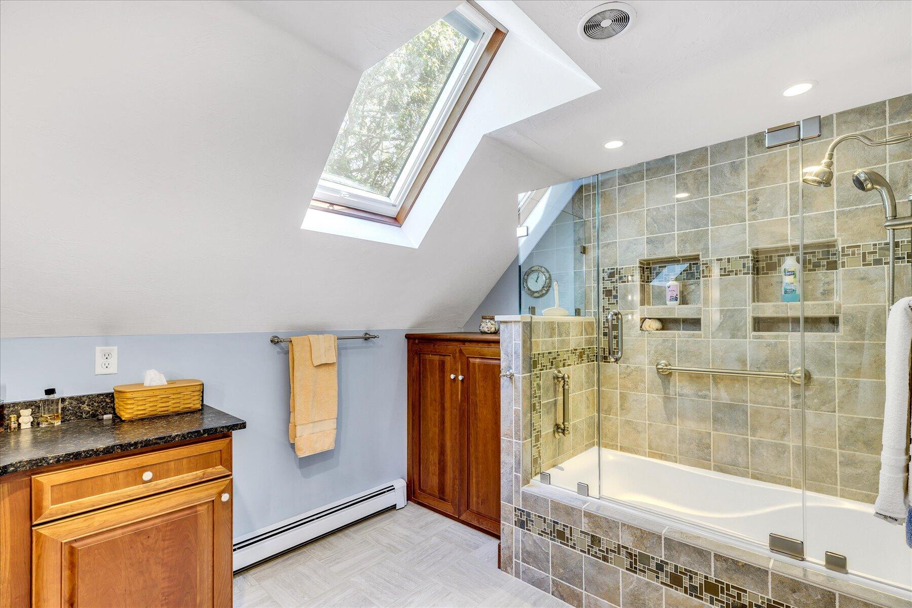 248 Wheeler Road Mashpee, MA 02649 - Photo 35 of 76 a bathroom with a tub and a sink