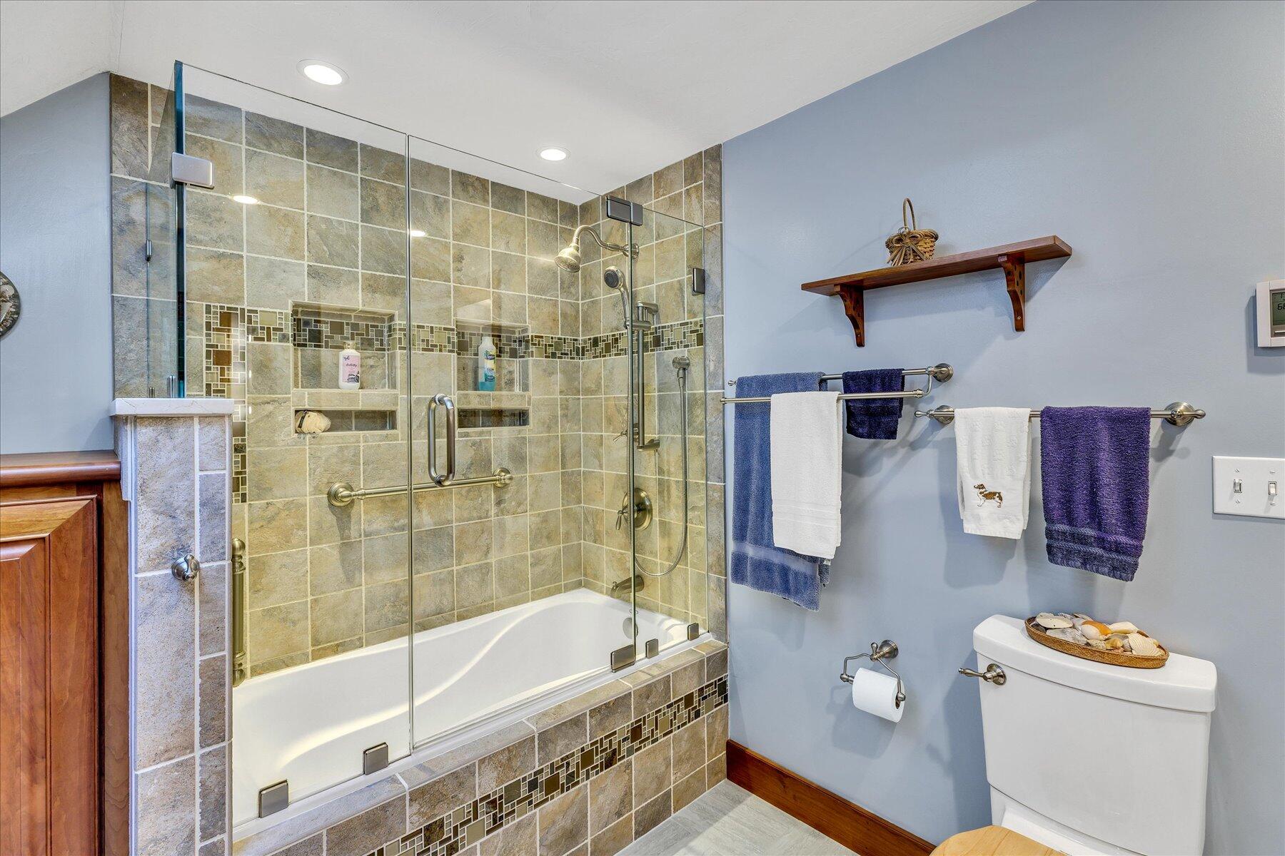 248 Wheeler Road Mashpee, MA 02649 - Photo 37 of 76 a bathroom with a bathtub shower sink vanity and toilet