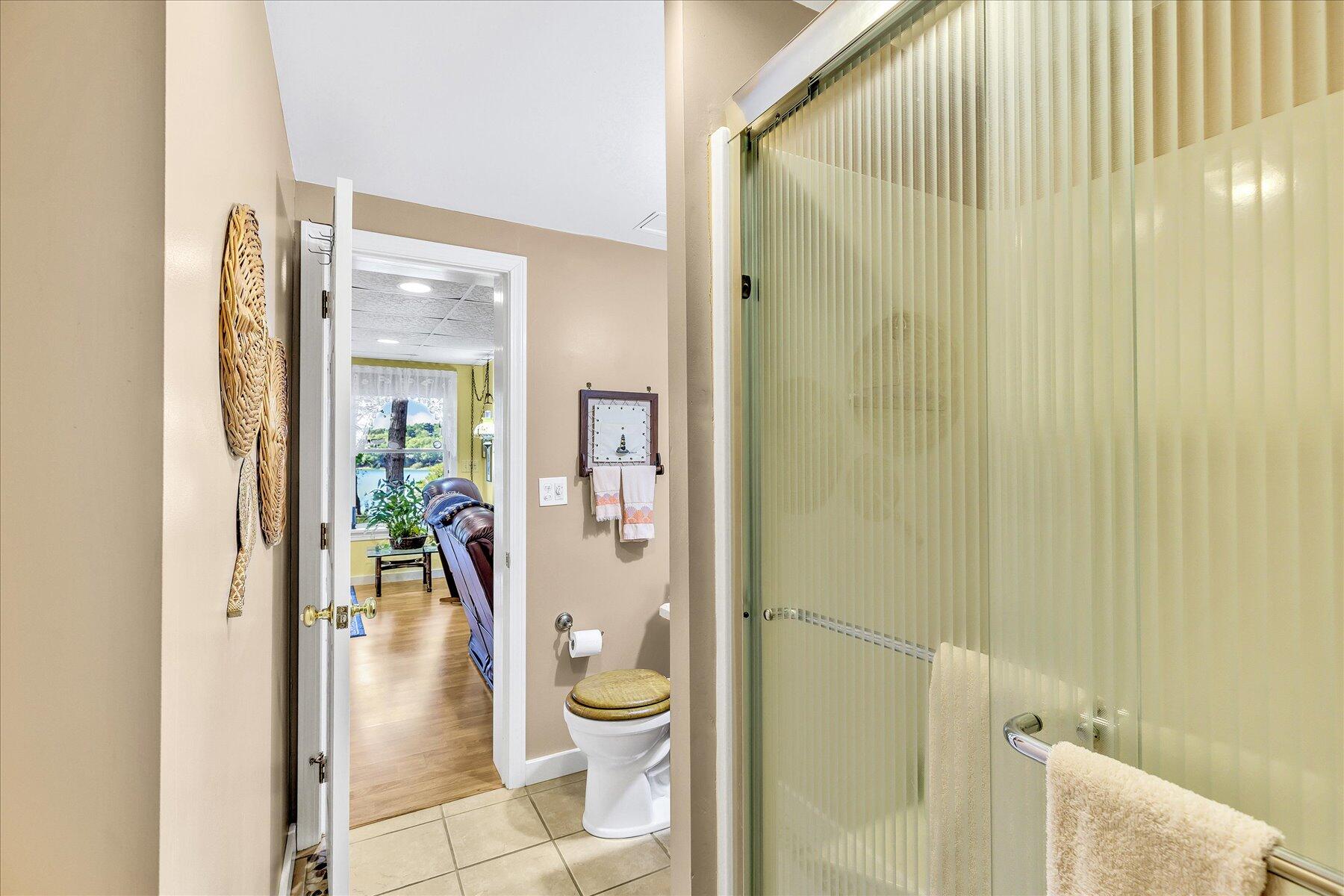248 Wheeler Road Mashpee, MA 02649 - Photo 44 of 76 a bathroom with a granite countertop bathtub shower and a toilet
