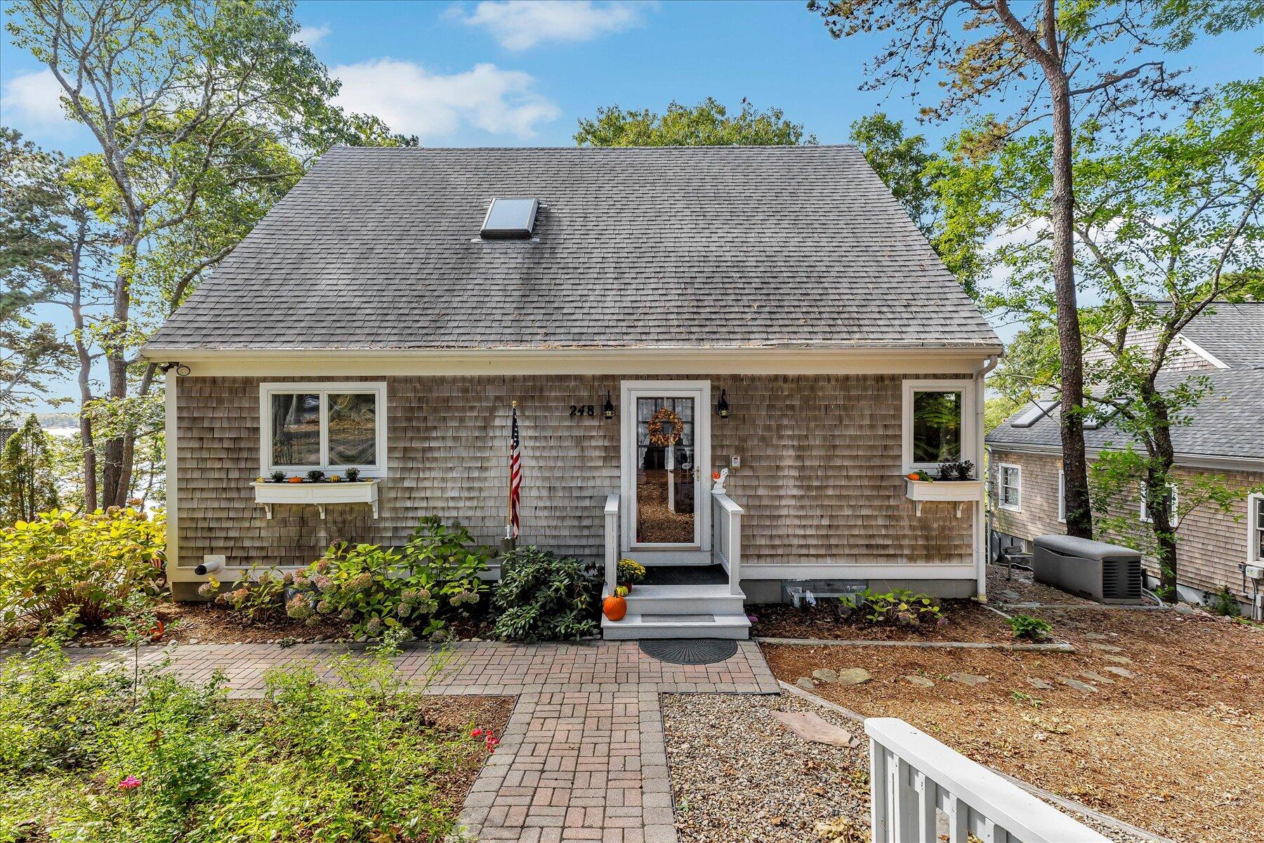 248 Wheeler Road Mashpee, MA 02649 - Photo 5 of 76 front view of house with a yard