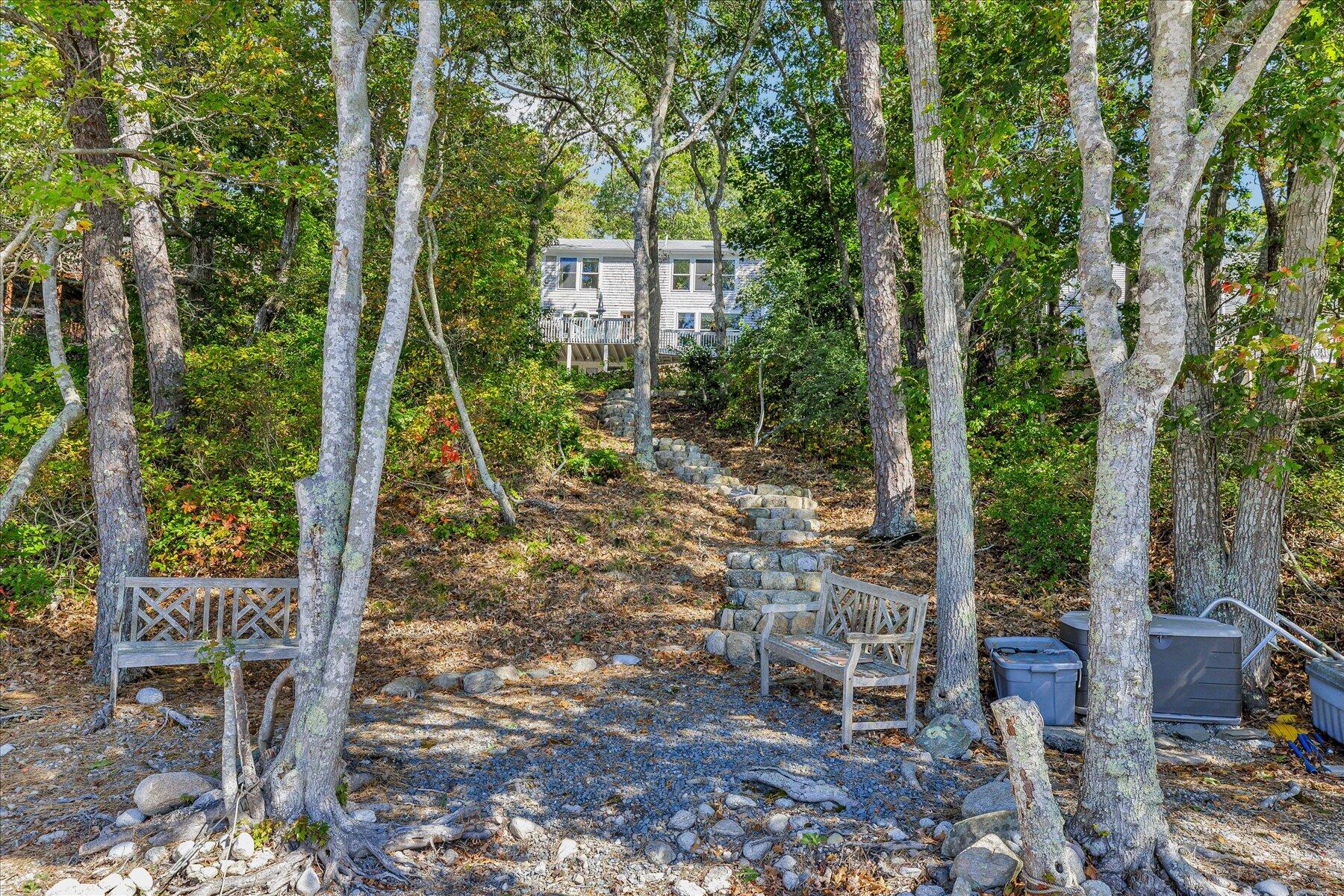 248 Wheeler Road Mashpee, MA 02649 - Photo 59 of 76 a view of a chair and table in backyard