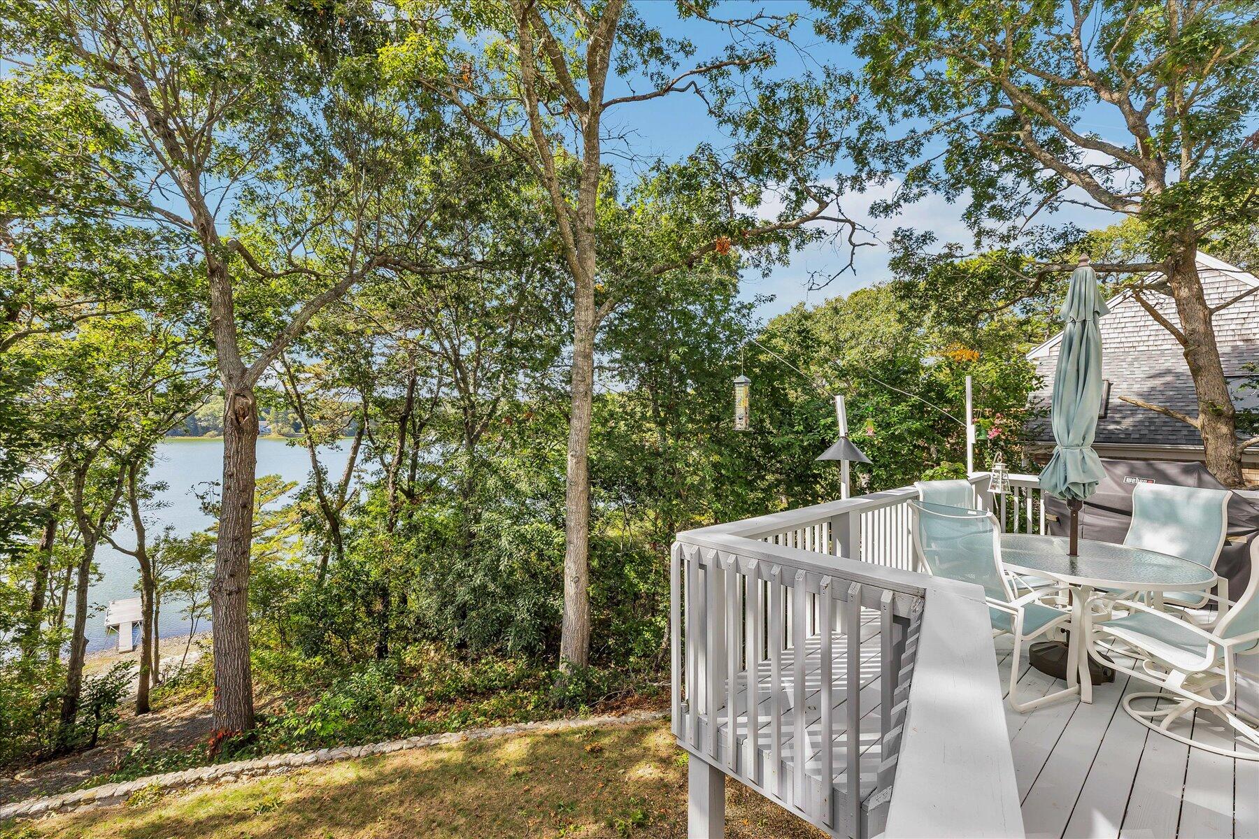 248 Wheeler Road Mashpee, MA 02649 - Photo 7 of 76 a view of balcony with wooden floor and outdoor seating