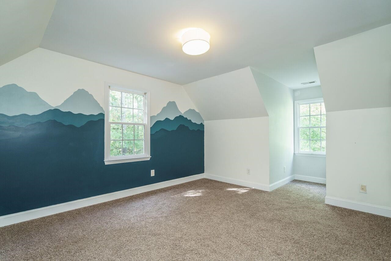 4202 Holt School Road Durham, NC 27704 - Photo 22 of 27 Ample closet space ensures that organization is a breeze, making these rooms both functional and inviting. Your loved ones will feel right at home in these cozy retreats. Bedroom