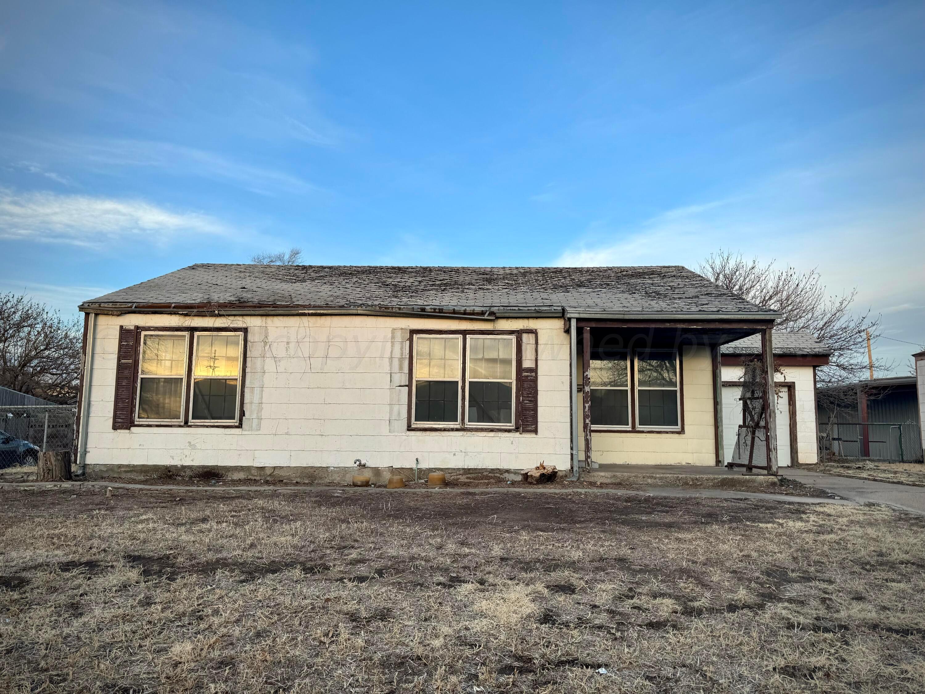 1303 Boyd Street Borger, TX 79007 - Photo 9 of 9 a front view of a house with a garden