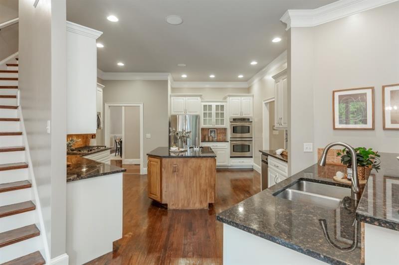 3505 Watson Road Cumming, GA 30028 - Photo 24 of 88 a kitchen with stainless steel appliances granite countertop a sink stove and refrigerator