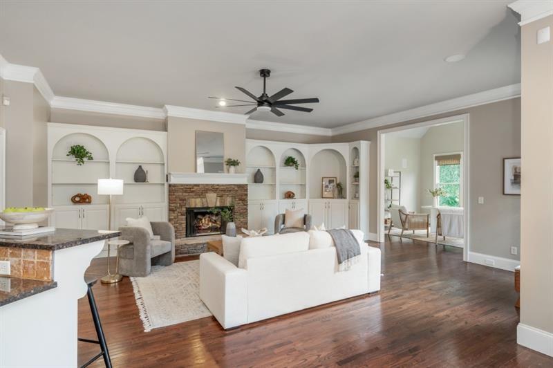 3505 Watson Road Cumming, GA 30028 - Photo 30 of 88 a living room with fireplace furniture and a large window