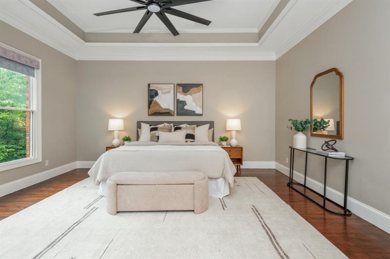3505 Watson Road Cumming, GA 30028 - Photo 49 of 88 a bedroom with a bed and a potted plant on the dresser