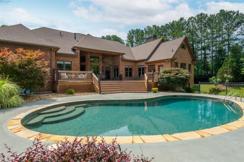 3505 Watson Road Cumming, GA 30028 - Photo 77 of 88 a view of a house with swimming pool and a yard