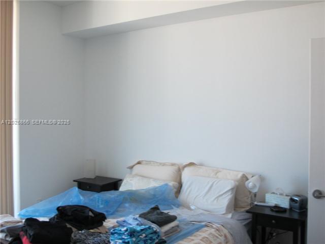 79 Southwest 12th Street, Unit 2911S Miami, FL 33130 - Photo 4 of 9 a living room with furniture and a lamp