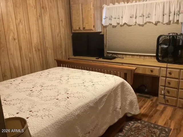 a bedroom with a bed and a cabinets