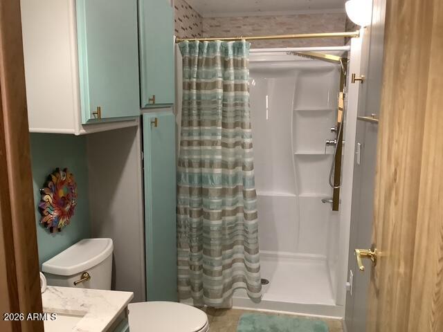 2605 South Tomahawk Road, Unit 10 Apache Junction, AZ 85119 - Photo 13 of 22 a bathroom with a toilet and a shower