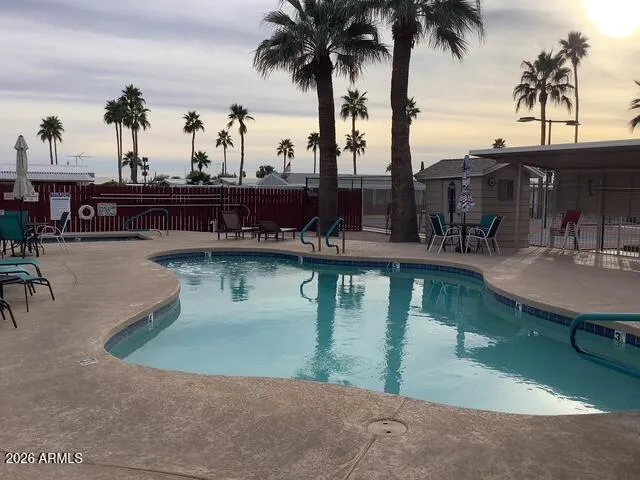 a view of a patio with a table and chairs