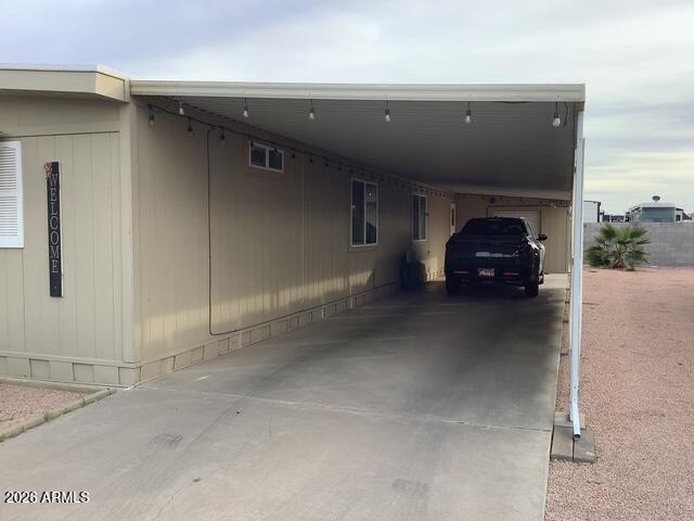 2605 South Tomahawk Road, Unit 10 Apache Junction, AZ 85119 - Photo 6 of 22 a car parked in parking area of a building