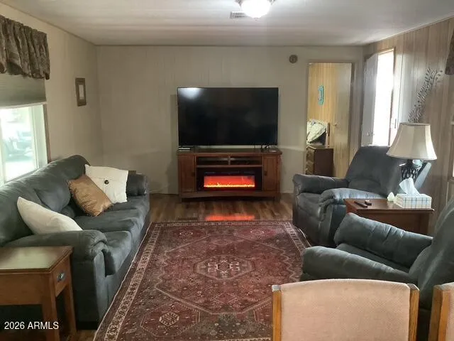 a living room with furniture and a flat screen tv