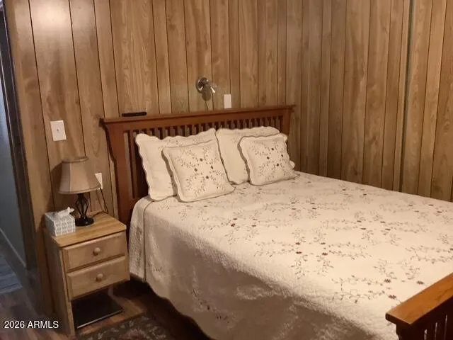 a bedroom with a bed and a cabinets